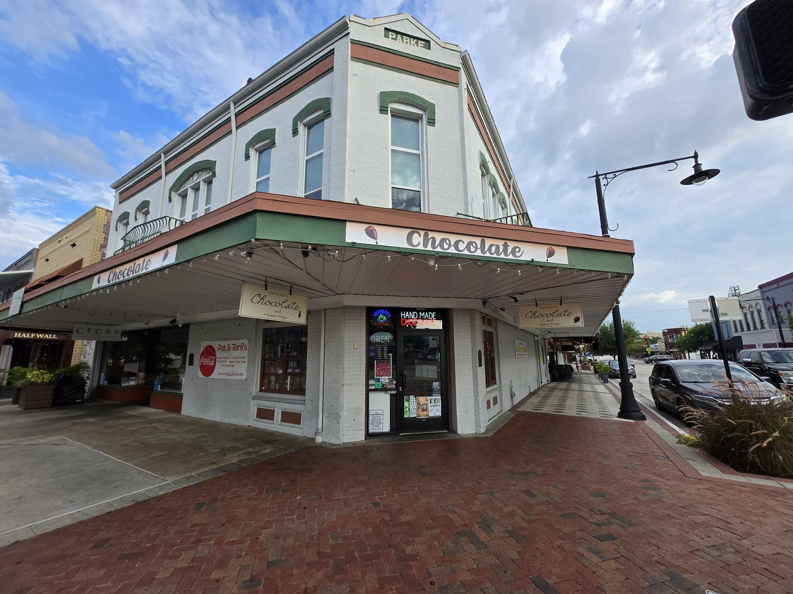 White corner Parke building housing Pat and Toni's Chocolate and Sweet Things shop in downtown DeLand.