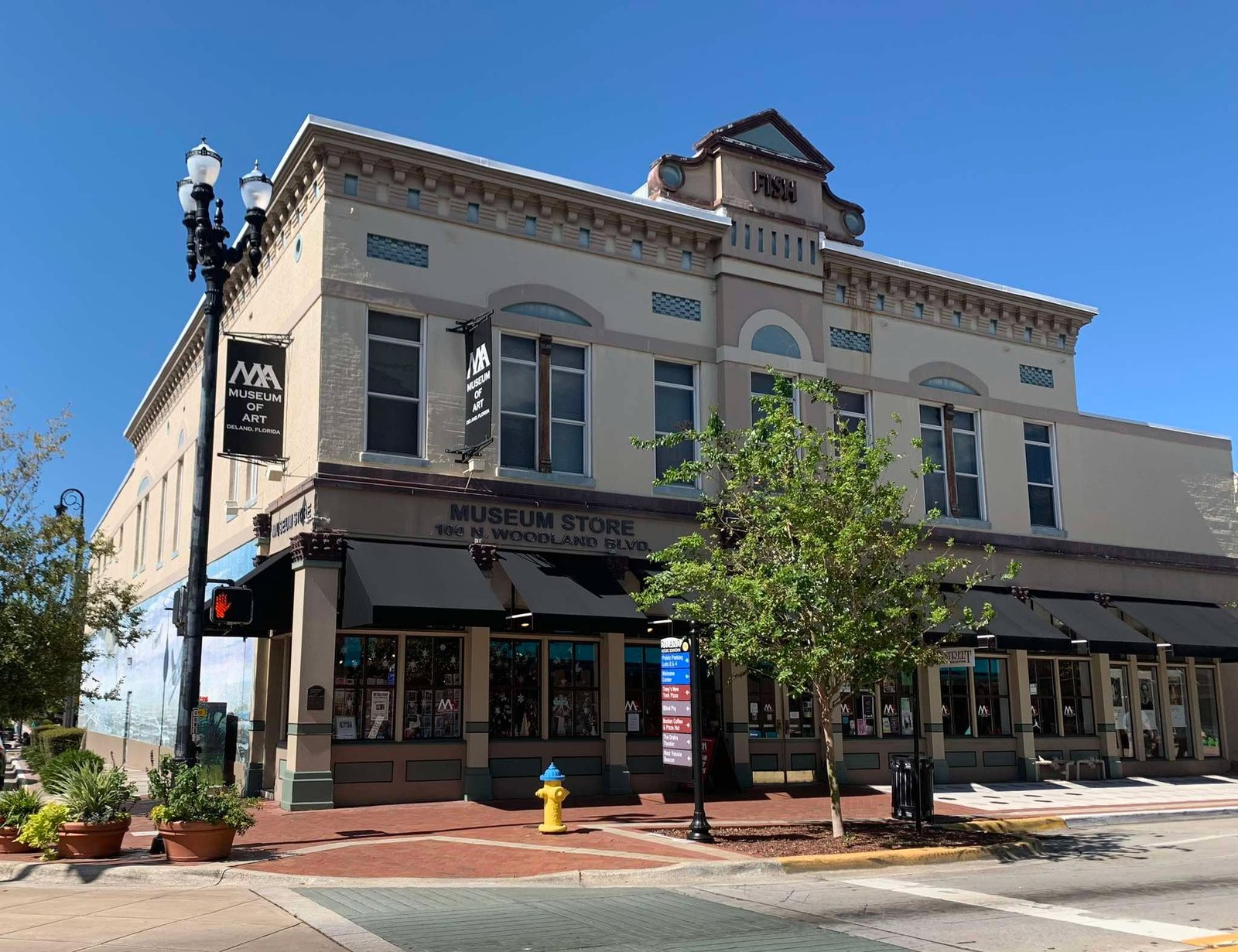 The Museum Store storefront and awning at 100 N Woodland Blvd in Downtown DeLand