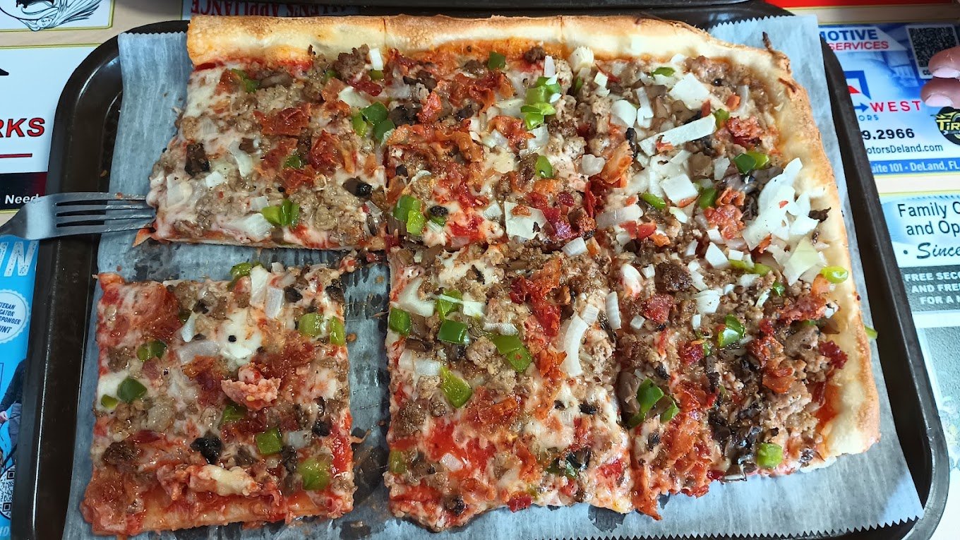 Tom's Pizza signature square, thin-crust pizza in DeLand