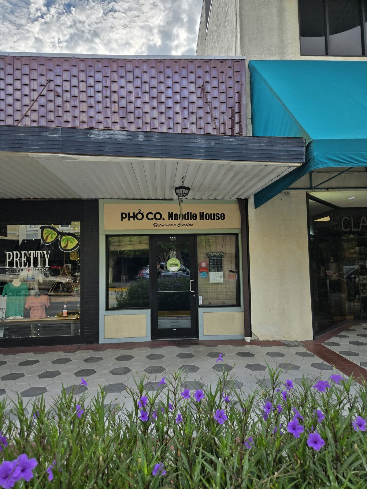 Storefront entrance of Pho Co. Noodle House, a Vietnamese restaurant, in downtown DeLand.